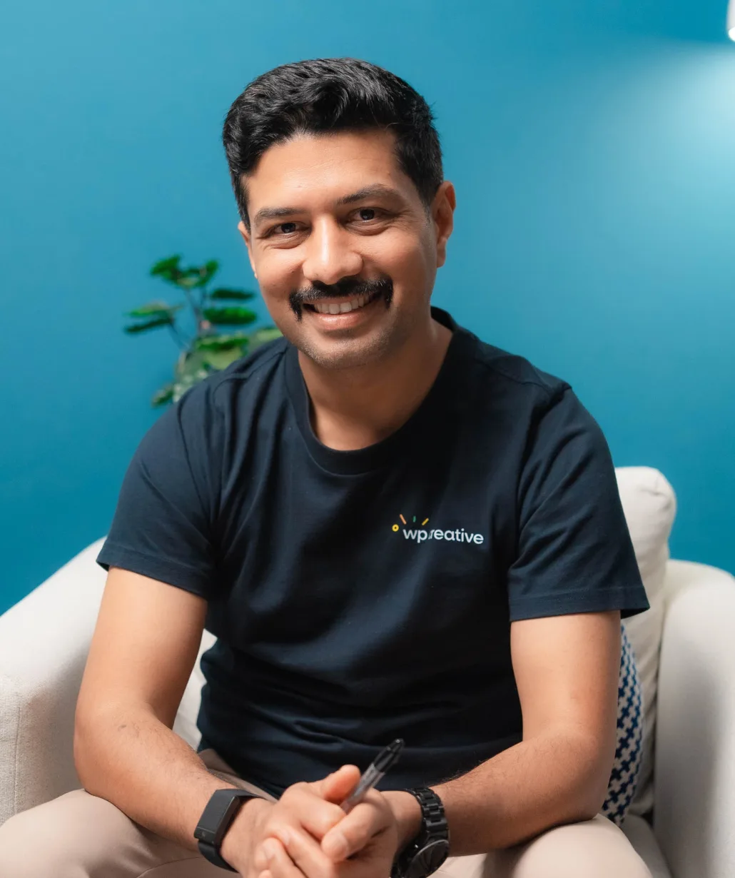 Nirmal Gyanwali, founder of WP Creative, seated in a podcast studio